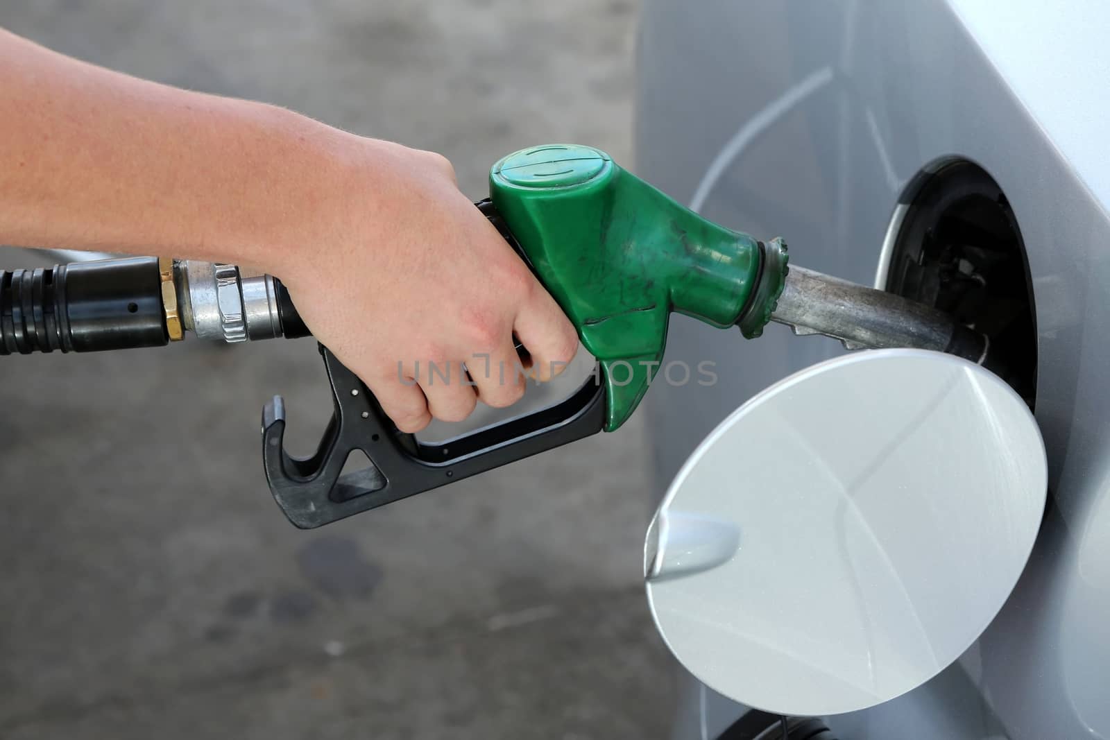 Petrol or gasoline being pumped into a motor vehicle car