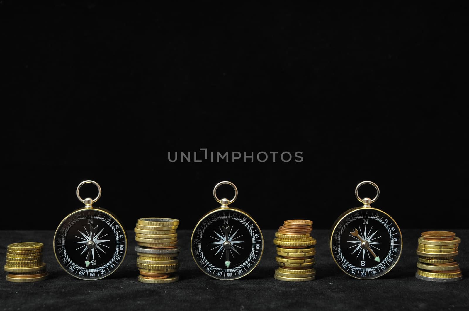 Orientation in  Business Compass and Money on a Black Background