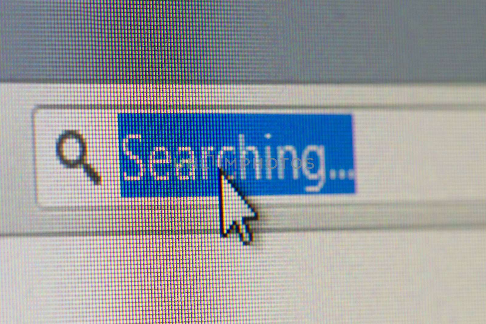 Close up macro of internet browser address bar with searching text selected with mouse arrow pointer.