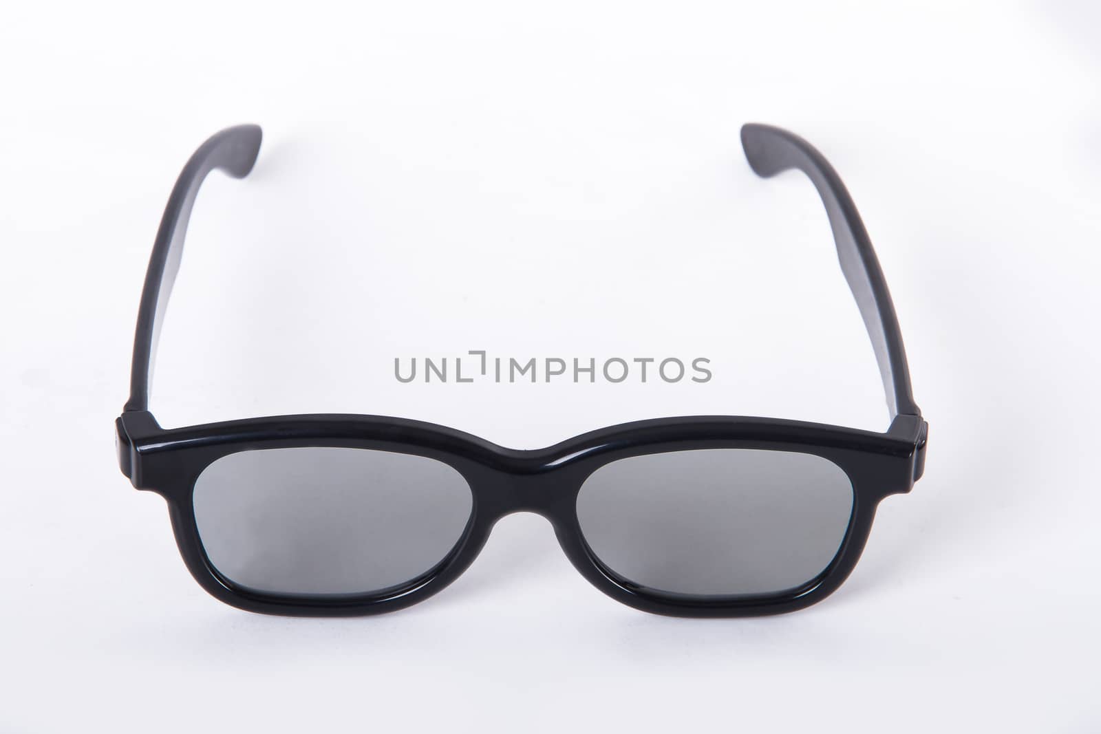 3D glasses with black frame for cinema, isolated on white background.