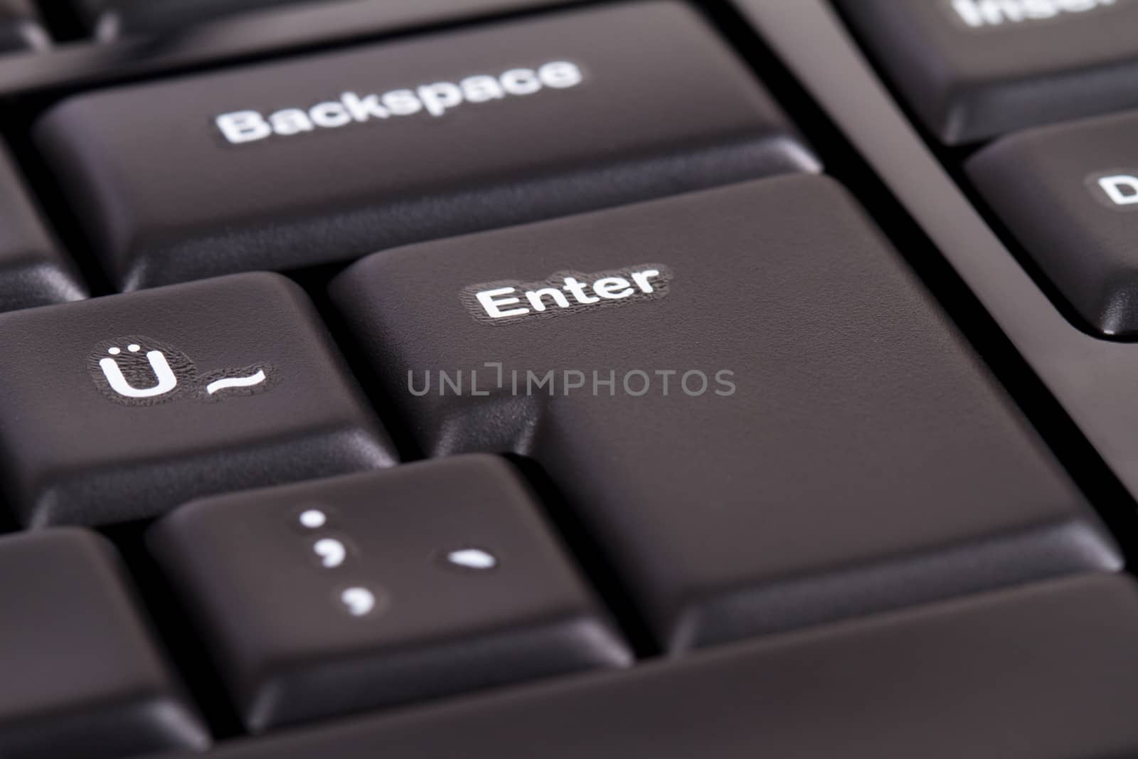 Enter key on black computer keyboard.