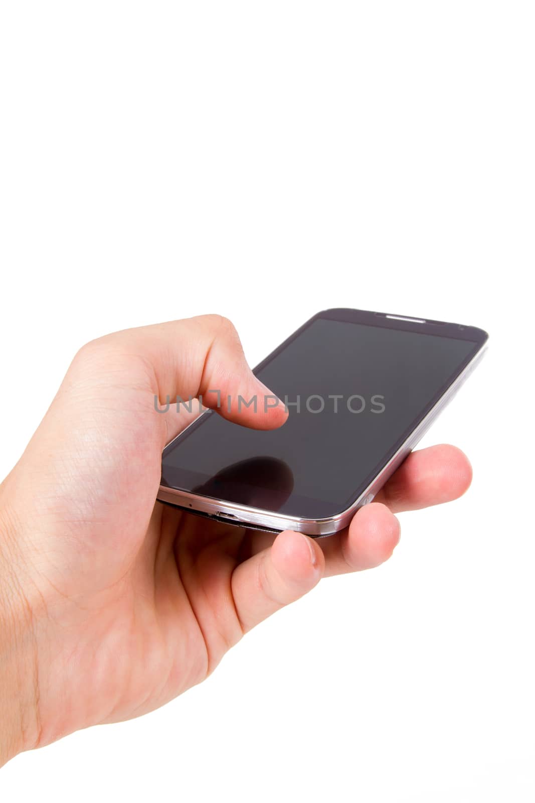 Hand holding mobile phone with blank, dark screen, isolated on white background.