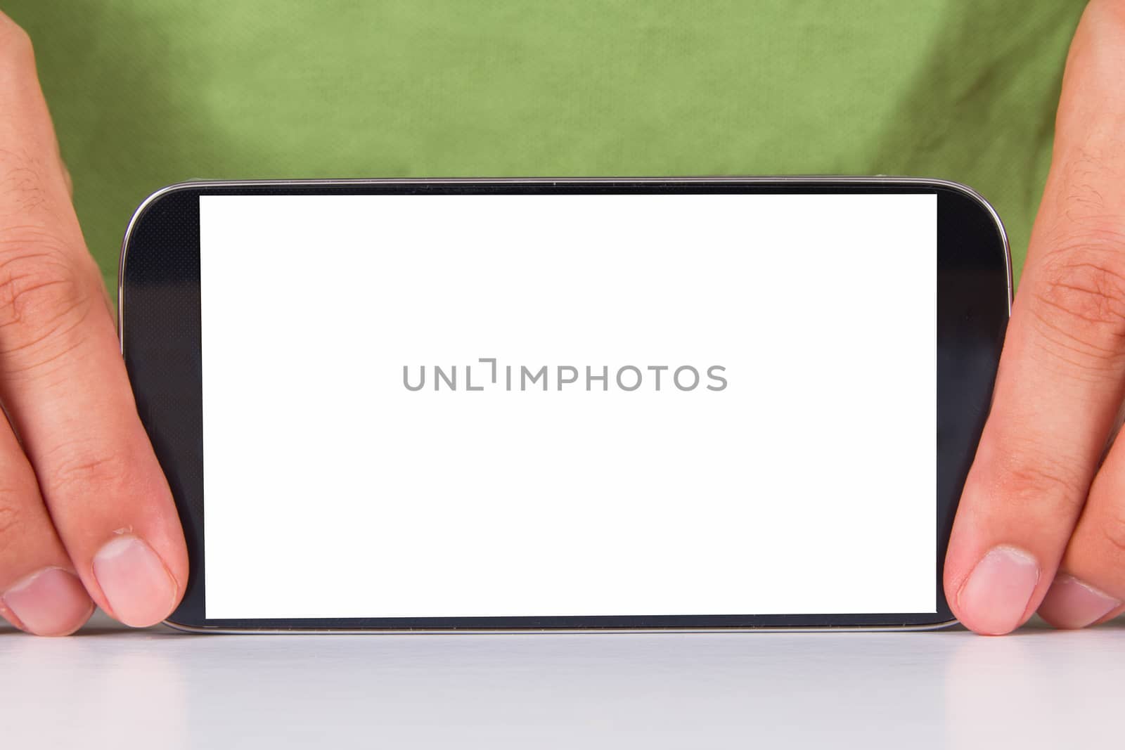 Hand holding and showing smart phone with blank, white screen, front view, isolated on white background.