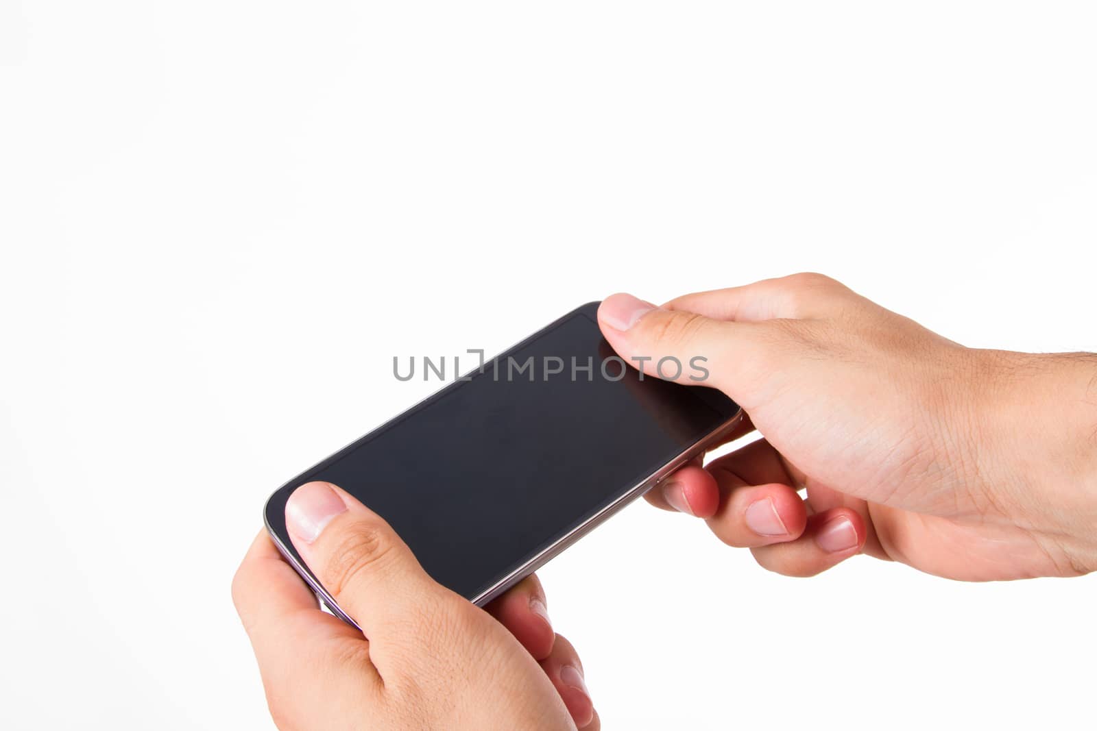 Hand holding smart phone with blank, dark screen, front view, isolated on white background.