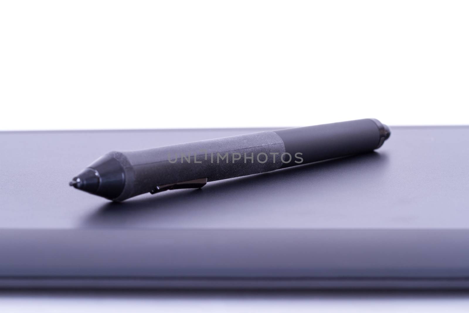 Digital pen on graphic tablet, isolated on white background.