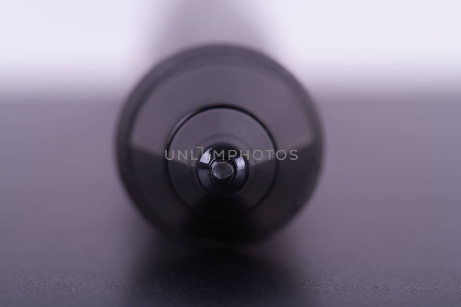 Focused on digital graphic pen point on tablet with depth of field.