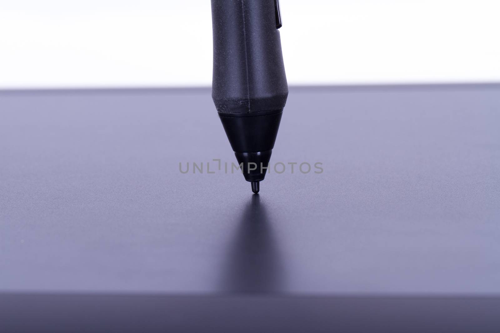 Pen on digital graphic tablet, isolated on white background.