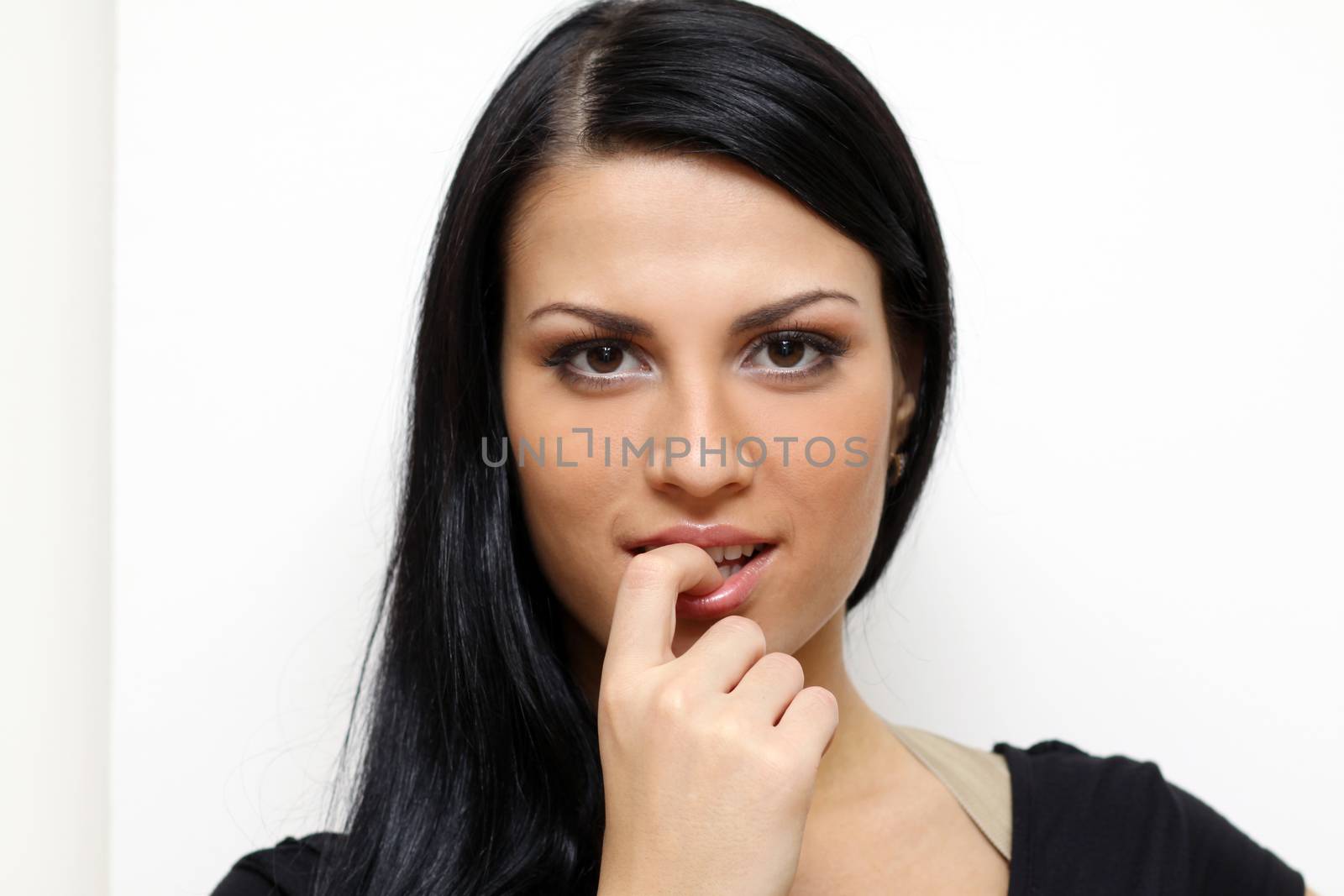 Beautiful young woman in gray background