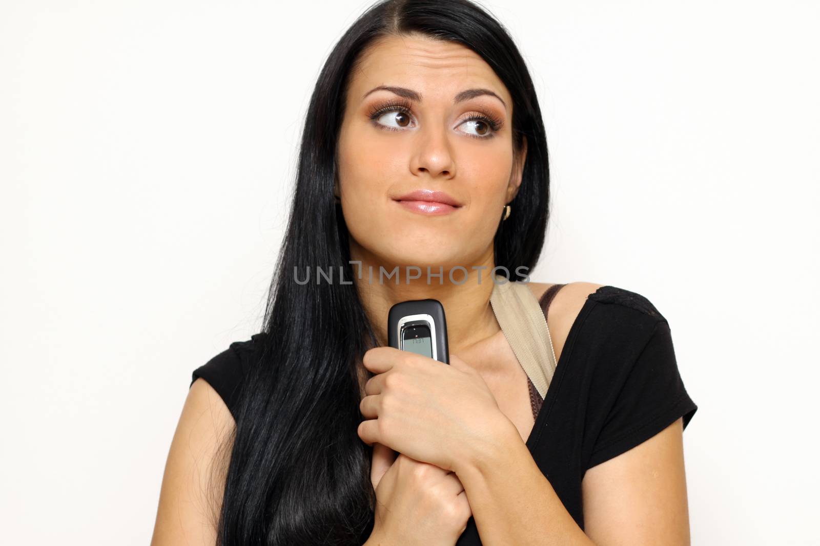 Young beautiful woman talking on cell phone