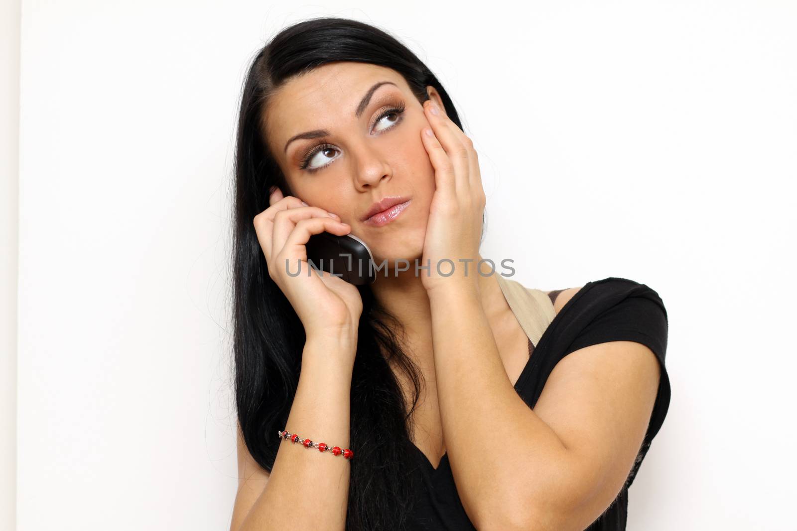 Young beautiful woman talking on cell phone