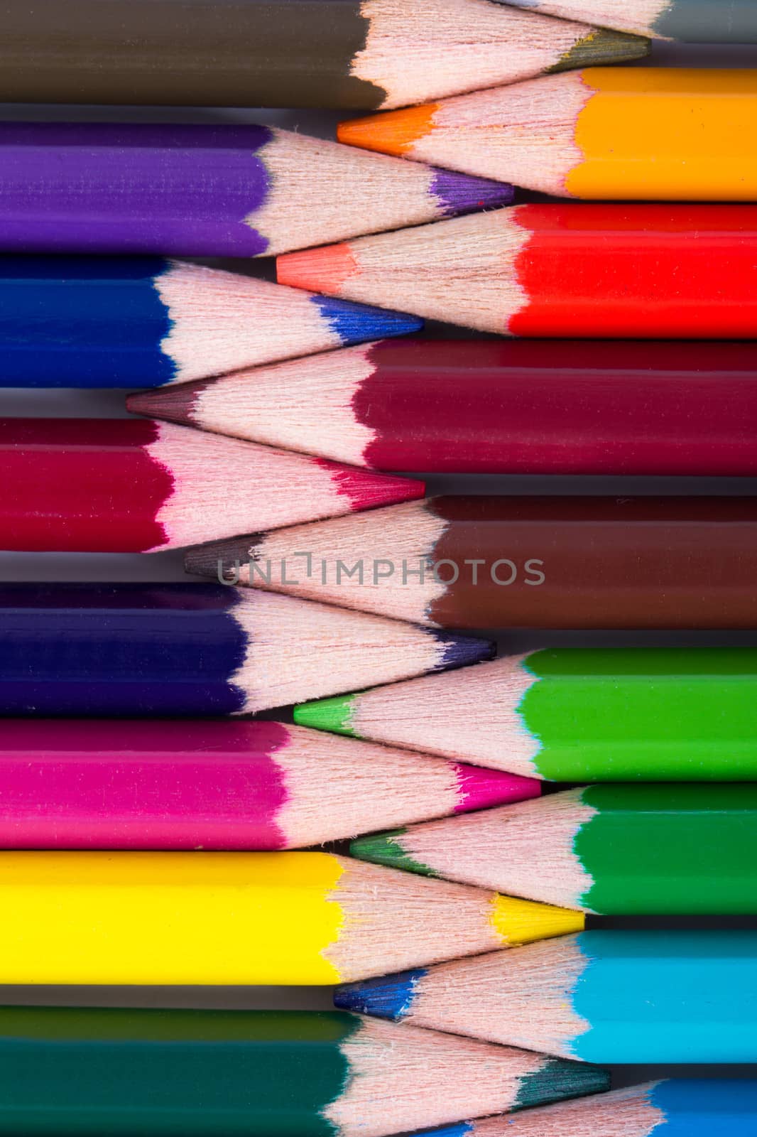 Colorful pencils inside each other as background.