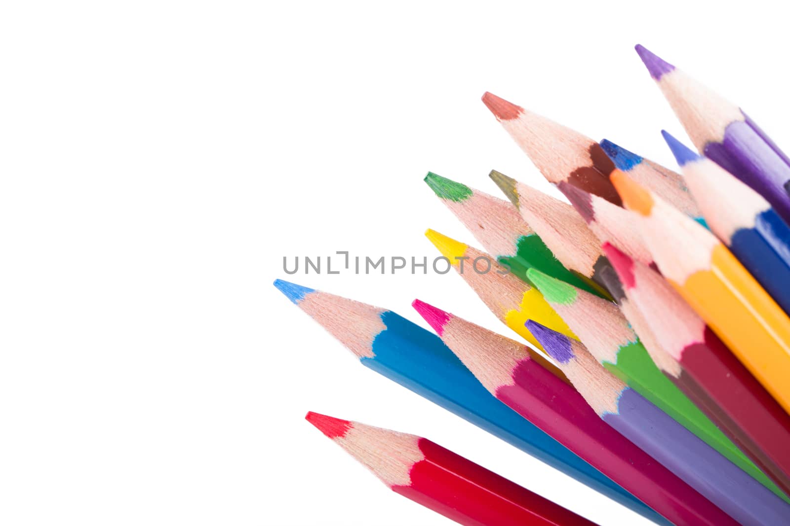 Colorful pencils with copyspace, isolated on white background.