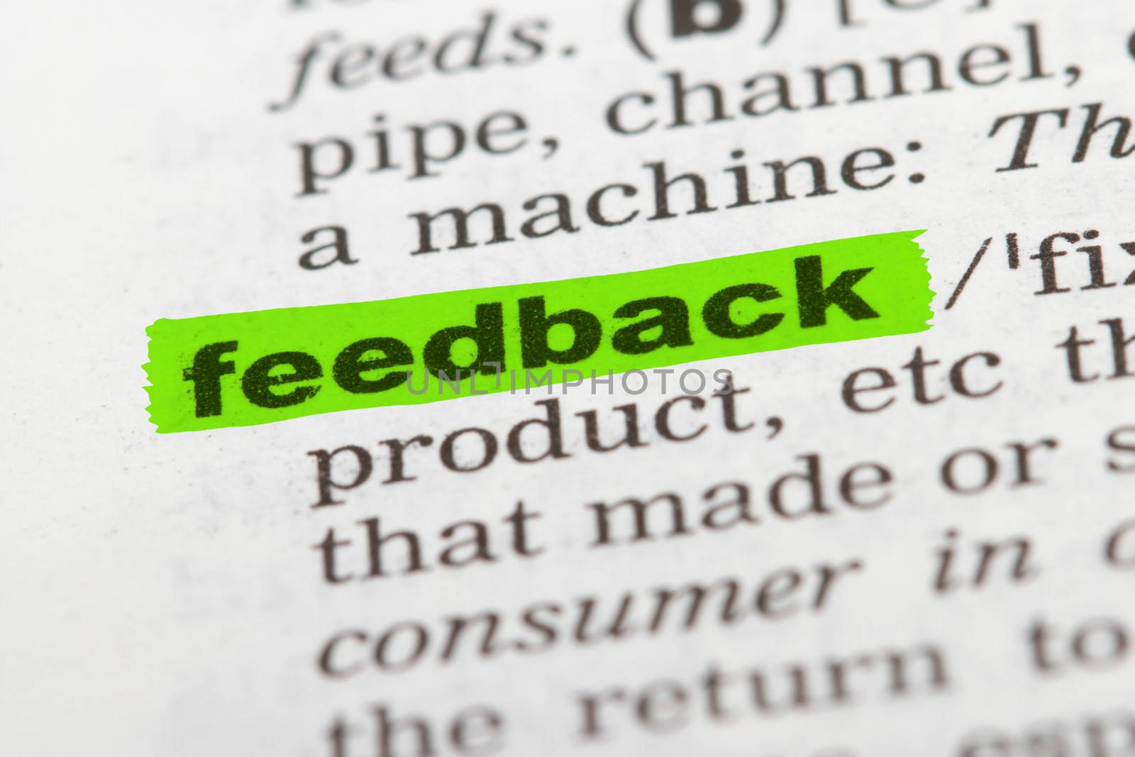 Feedback word highlighted with green marker on dictionary page.