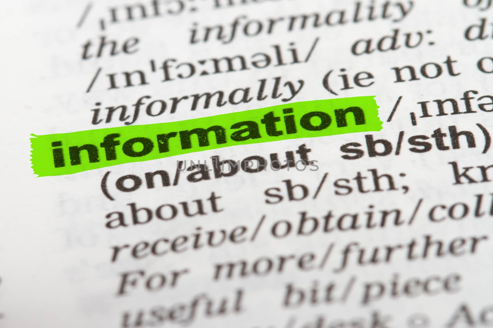 Information word highlighted with green marker on dictionary page.