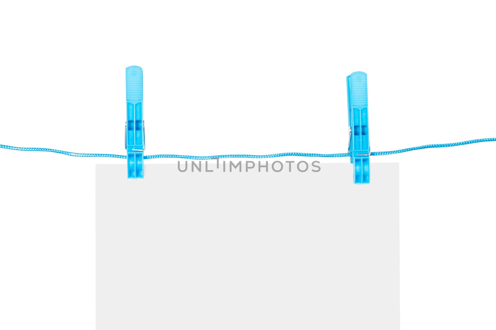 White, blank paper on rope with blue, plastic clothespin, isolated on white background.