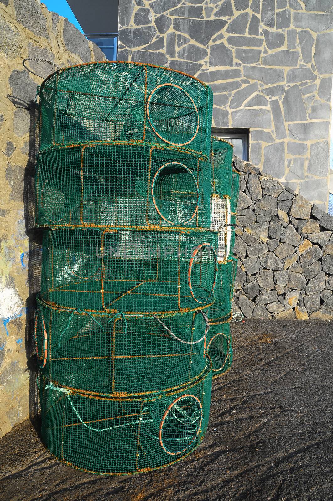 Empty Green Net Fish Traps on a Pier