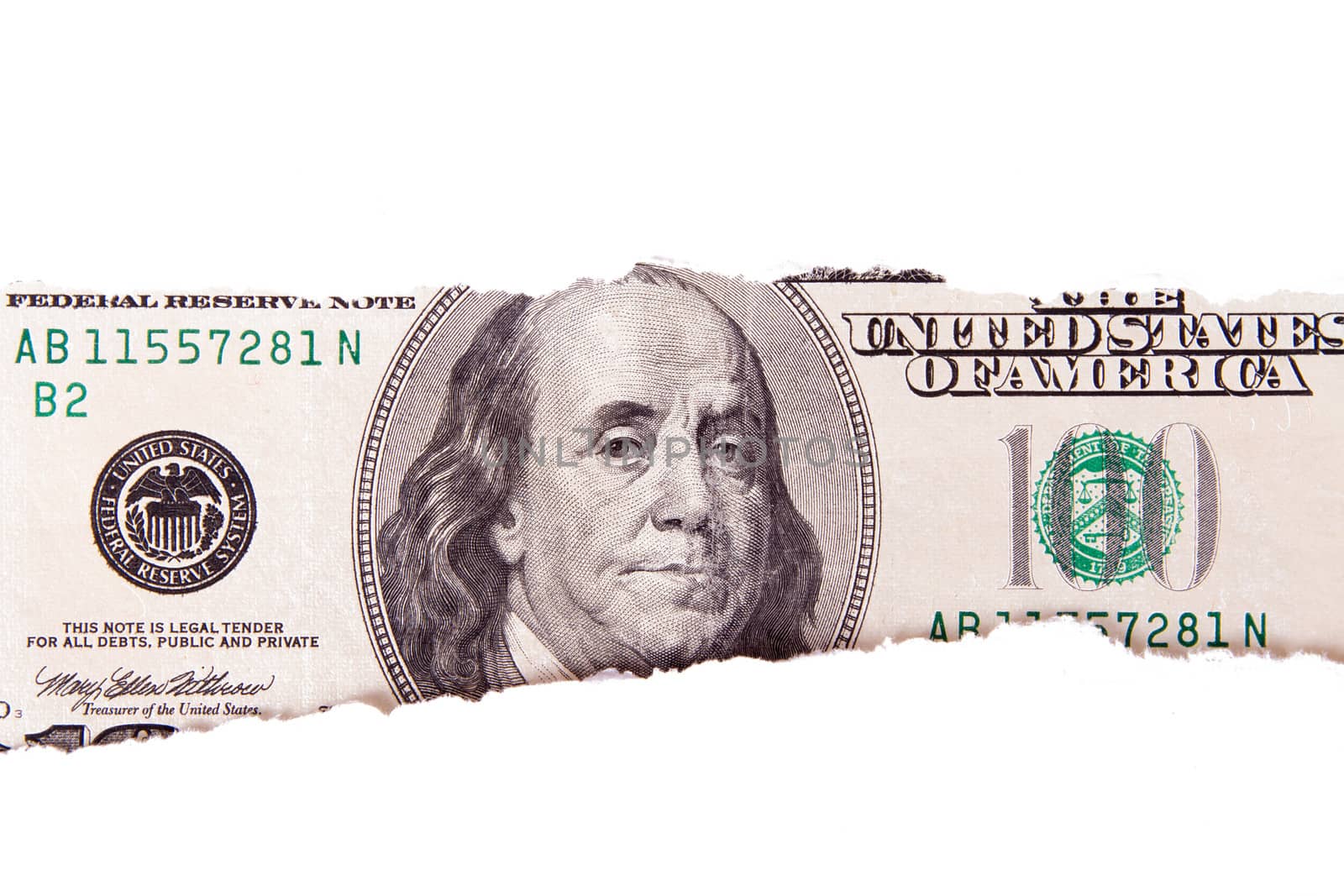 One hundred dollar bill with teared white papers, isolated on white background.