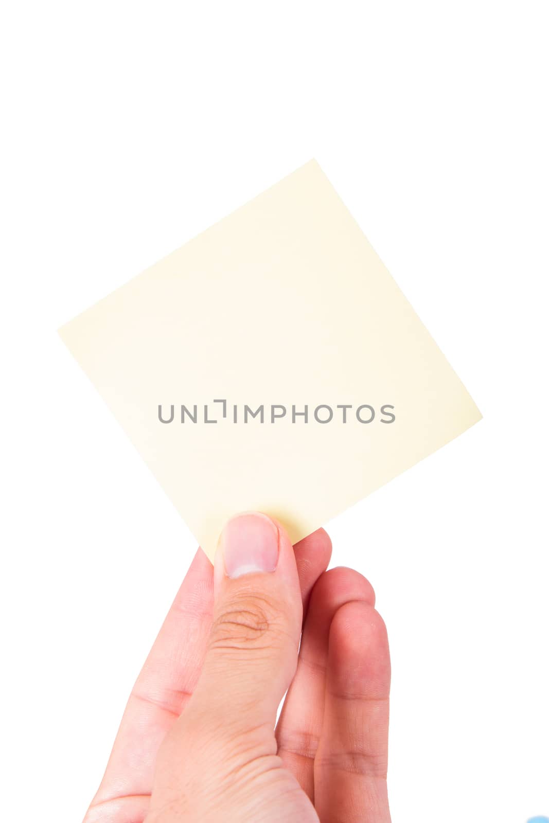 Hand holding blank, empty, yellow sticky post it note with copy space, isolated on white background.