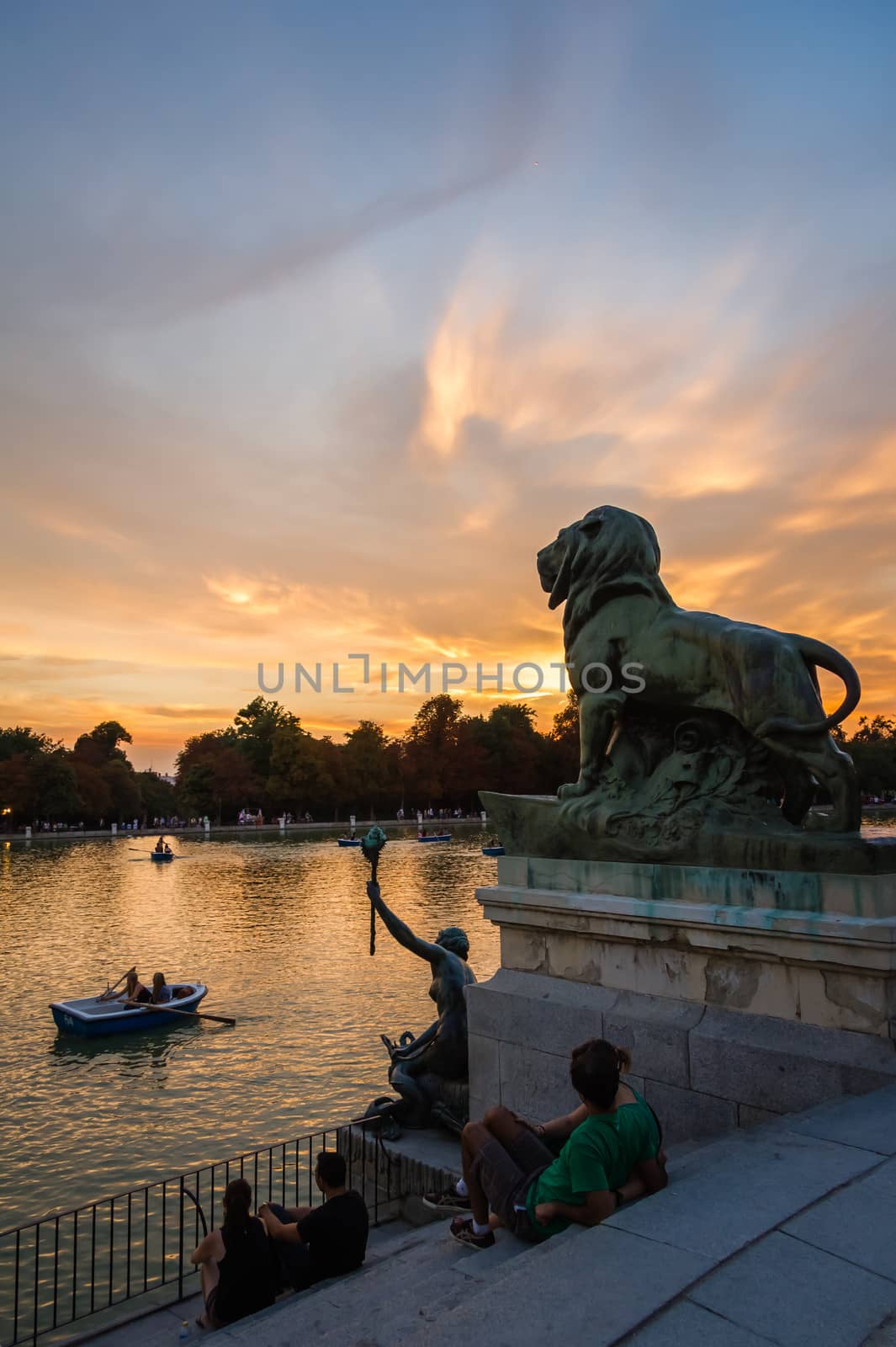 Lion sculpture in Buen Retiro park lake, Madrid by doble.d