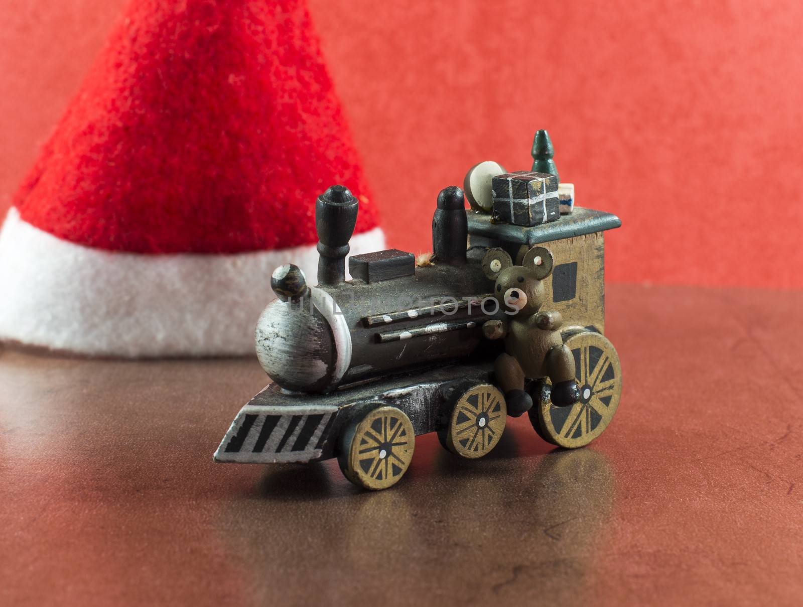 old wooden train with presents and teddy for christmas