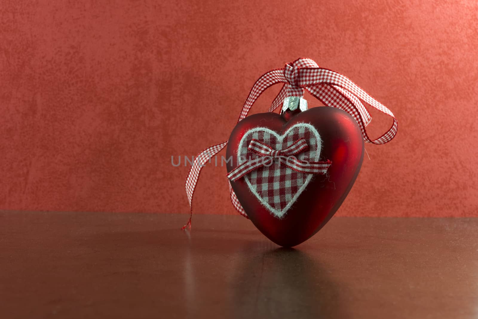 red christmas heart on red and golden background