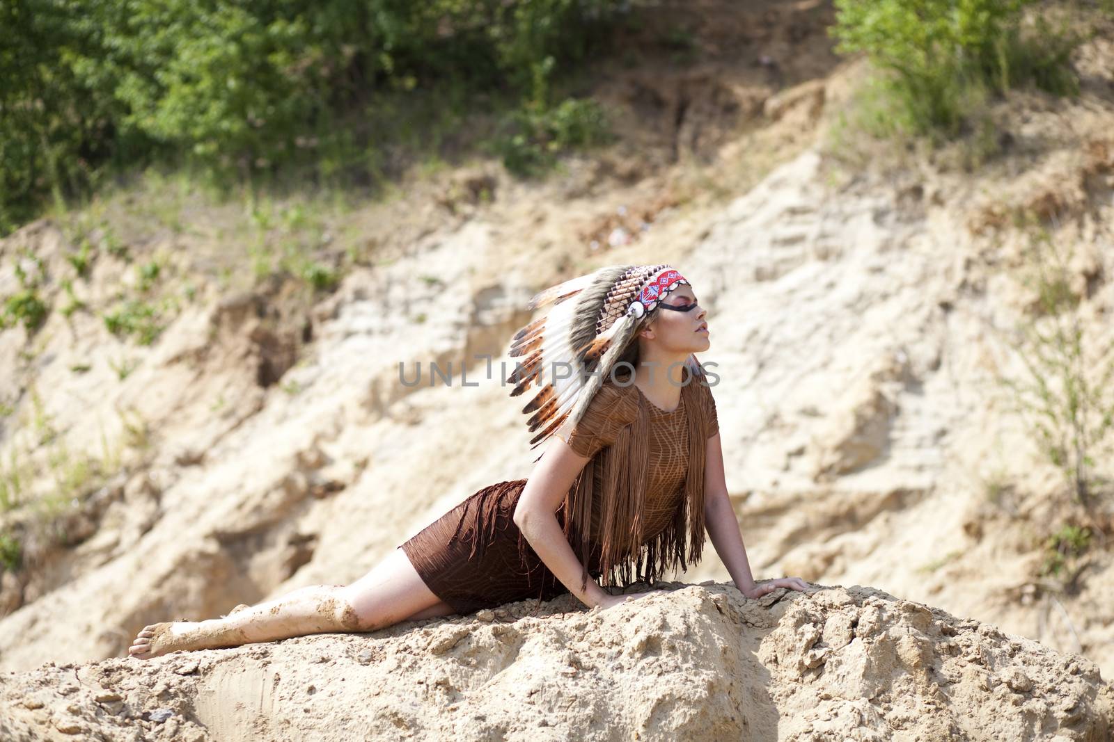 Young woman in costume of American Indian