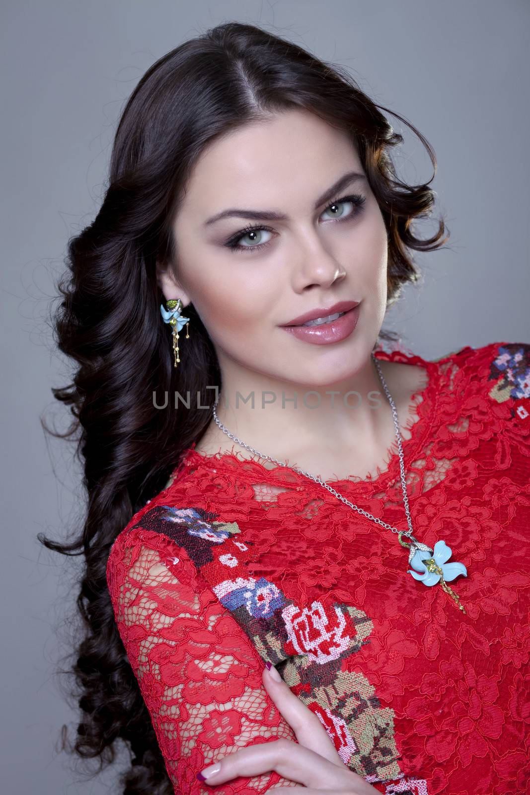 Beautiful young woman in gray background