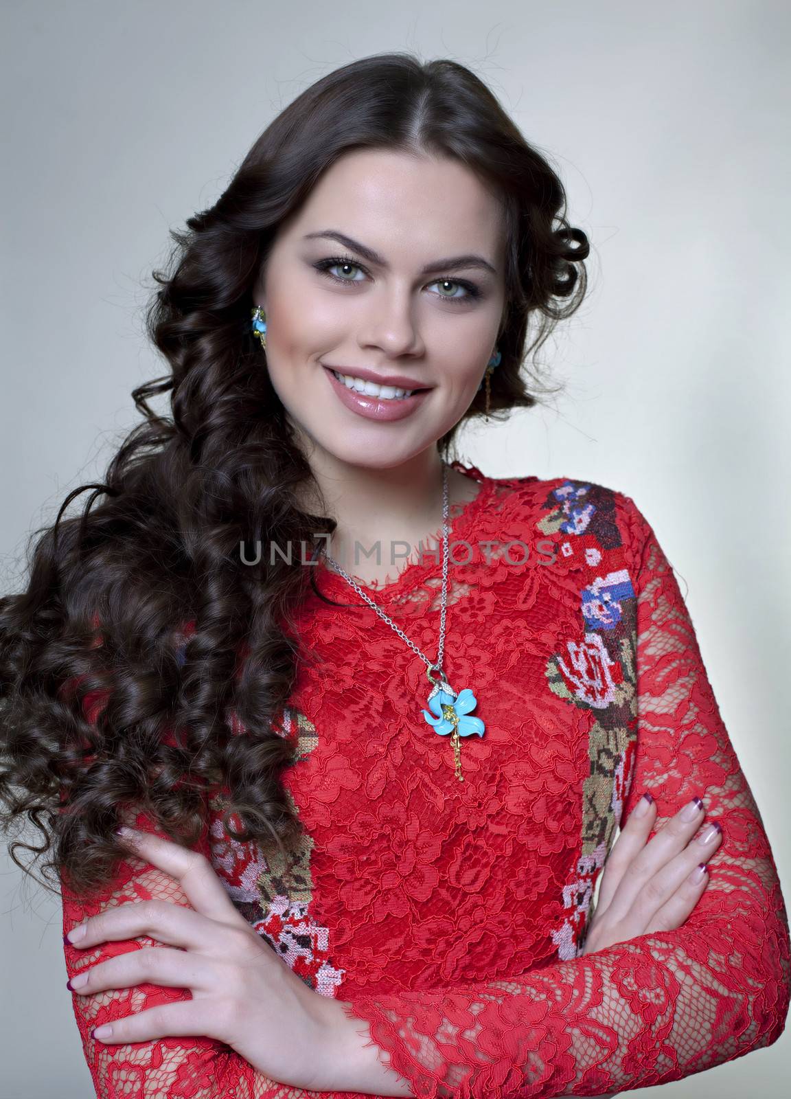 Beautiful young woman in gray background