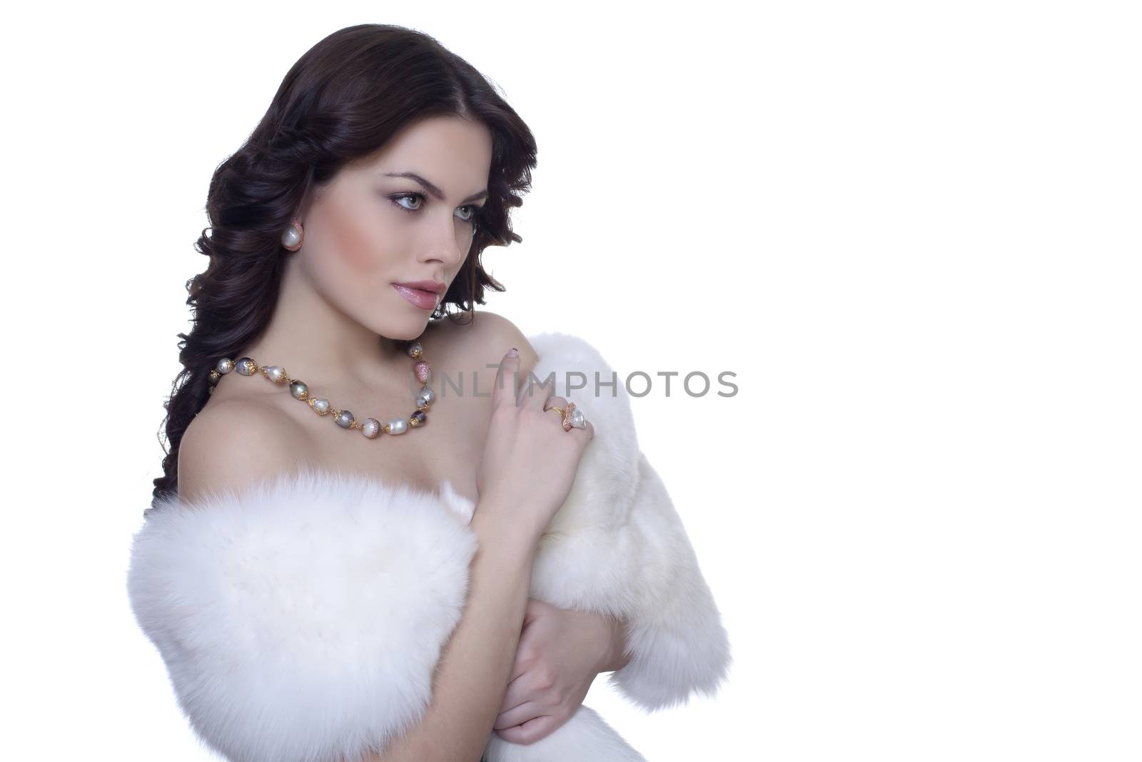 Portrait of attractive brunette in a fur coat