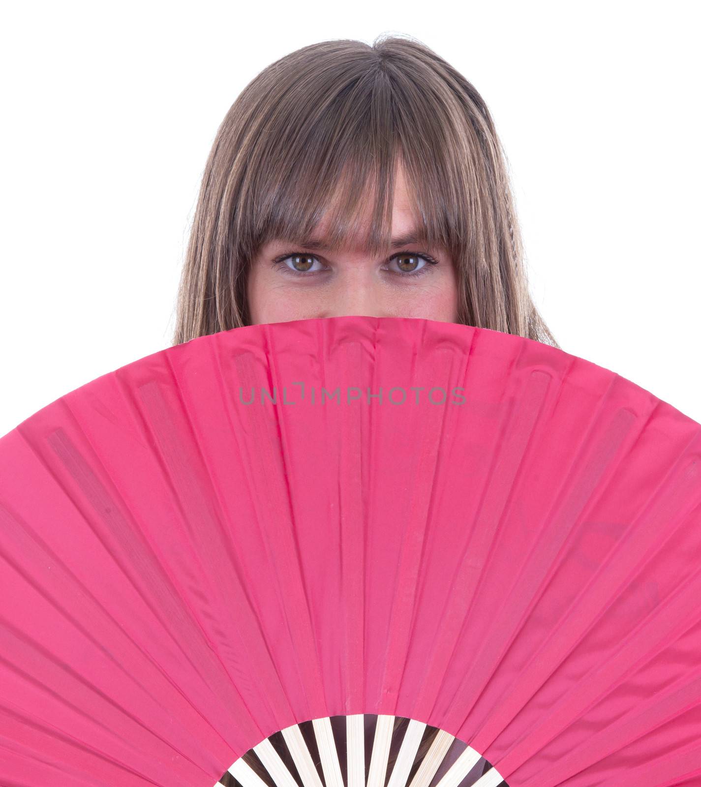 Studio portrait of a womans face partly hidden by a fan, isolated on white