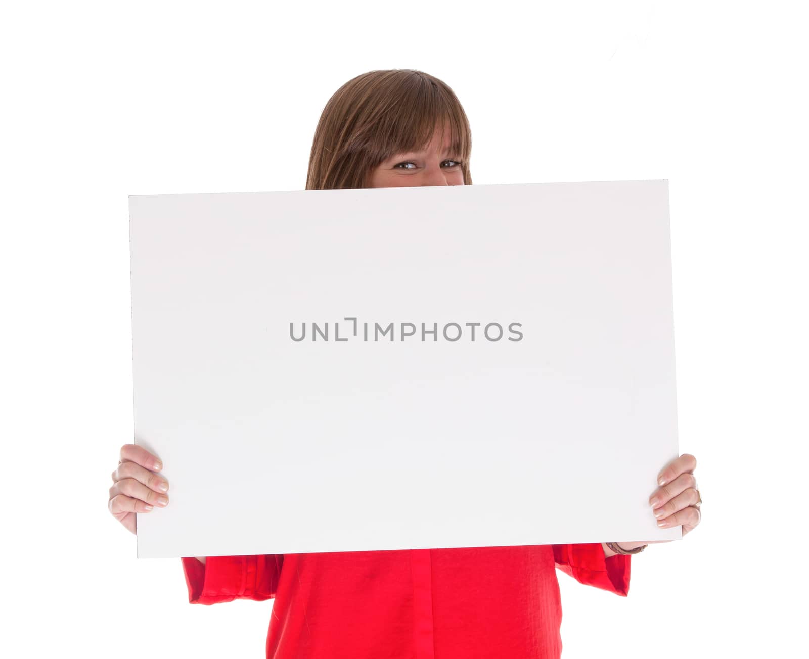 Shy woman holding a big blank card, isolated on white