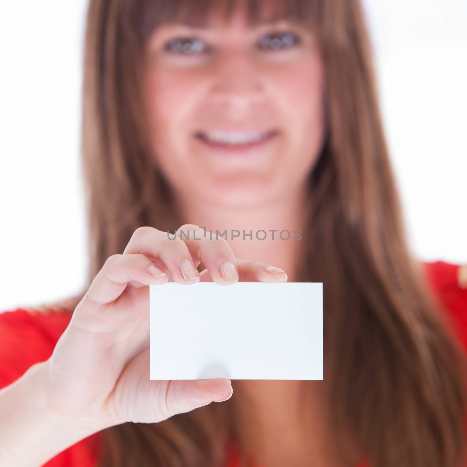 Woman showing a blank business card, close-up