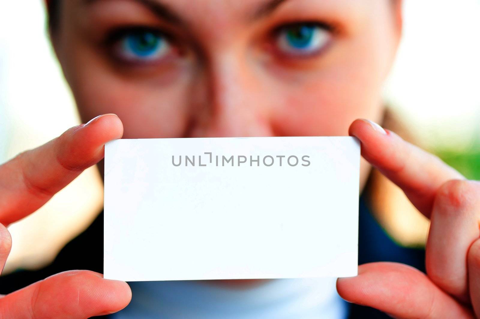 A girl showing a blank business card by kosmsos111