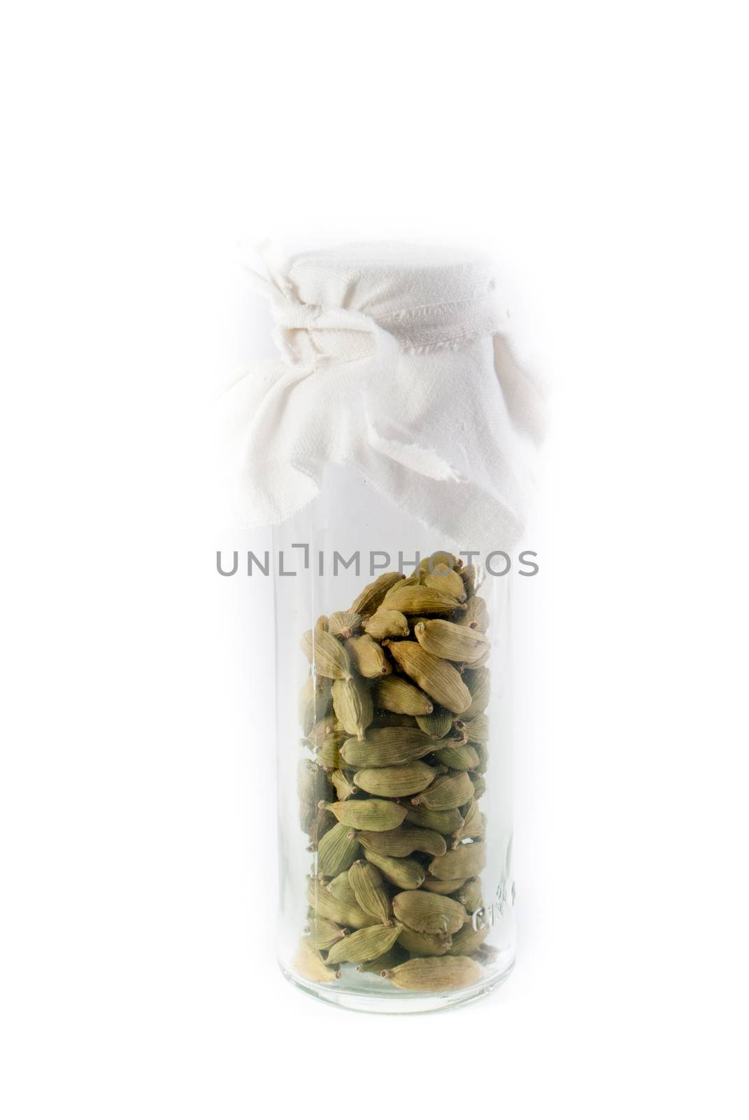 Pile of whole cardamom on white background