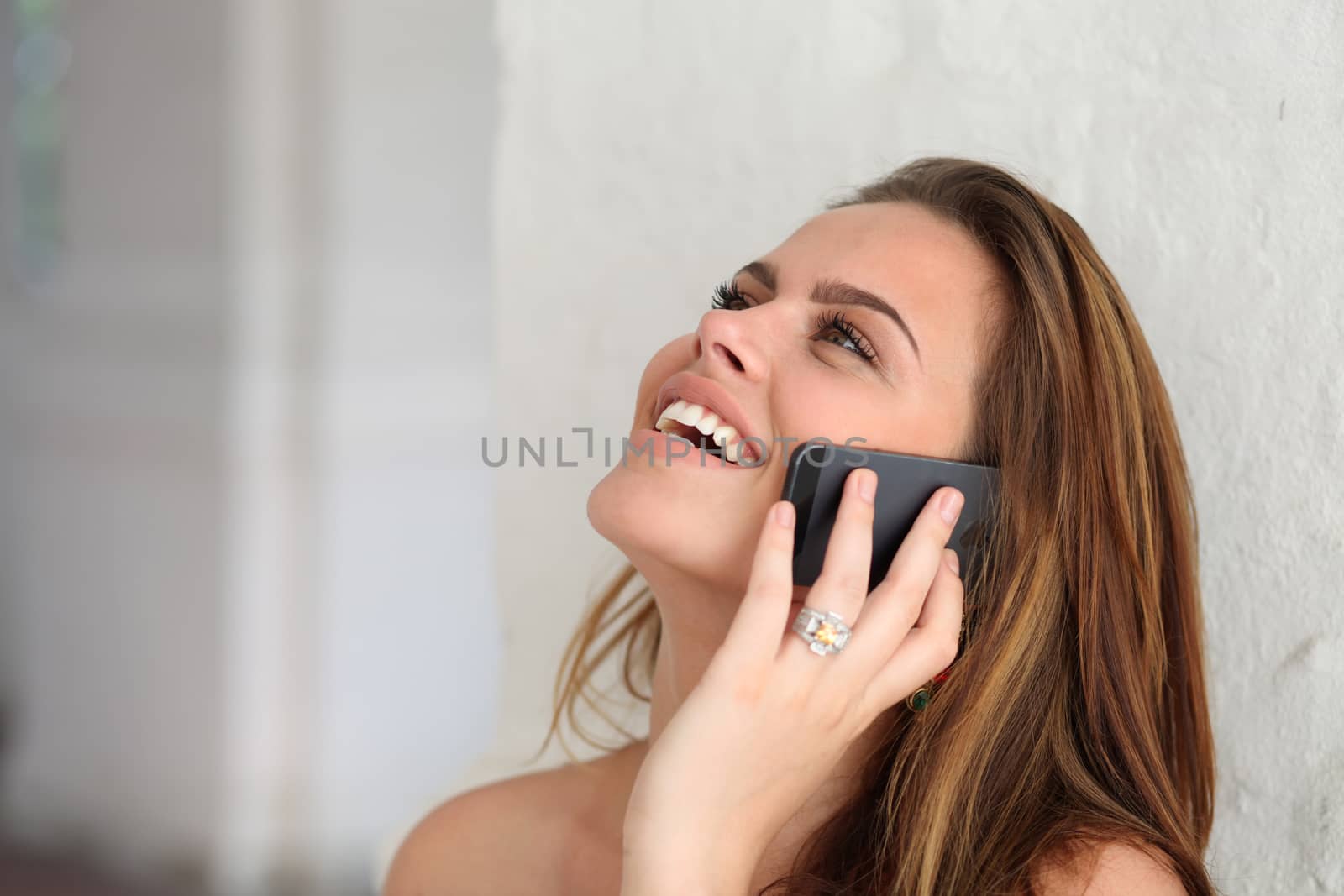 Young beautiful woman talking on cell phone