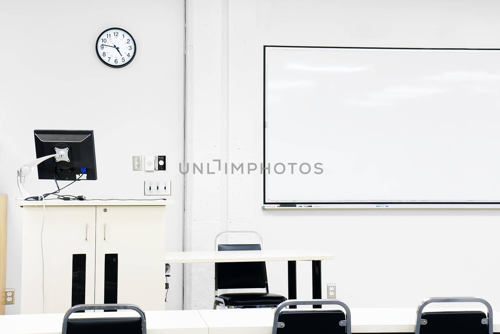 Sterile modern classroom with computer and white board