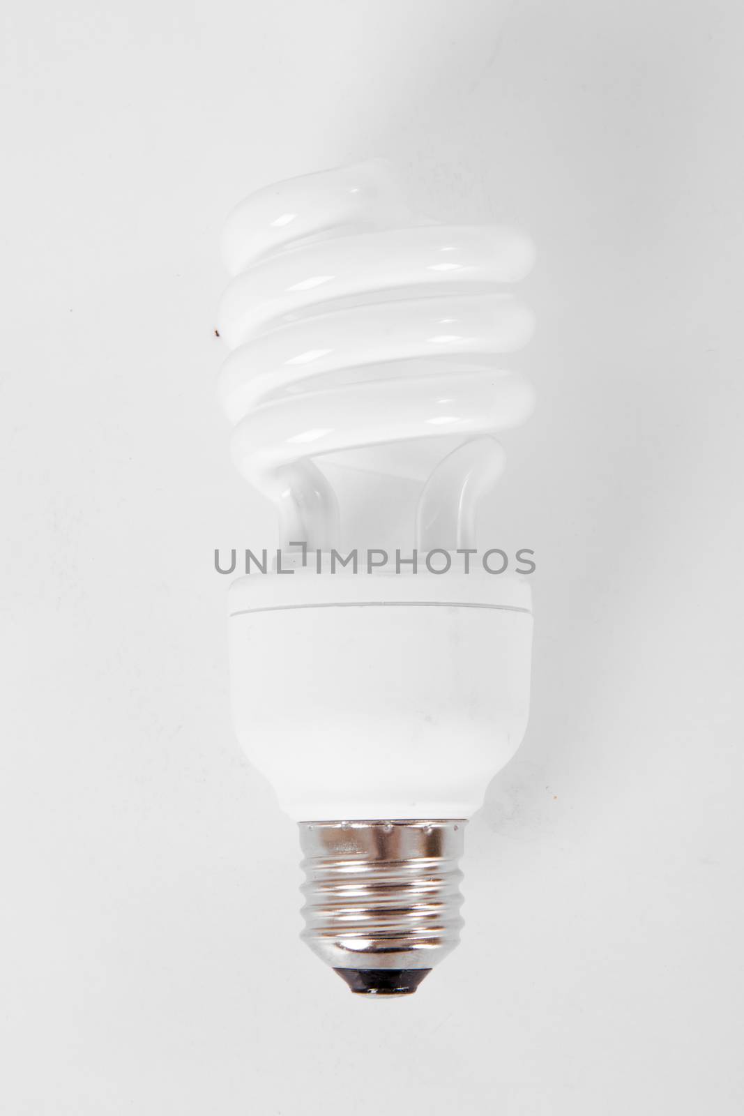 Signle affordable light bulb on white.
