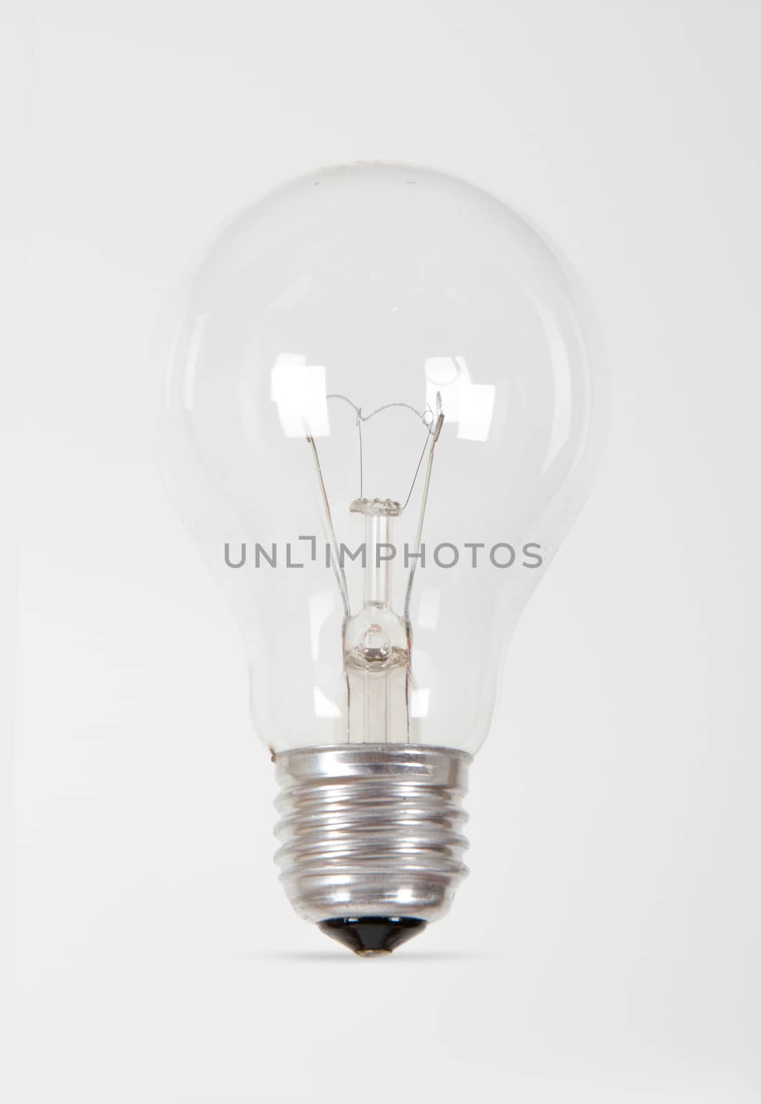 Single light bulb on white background.