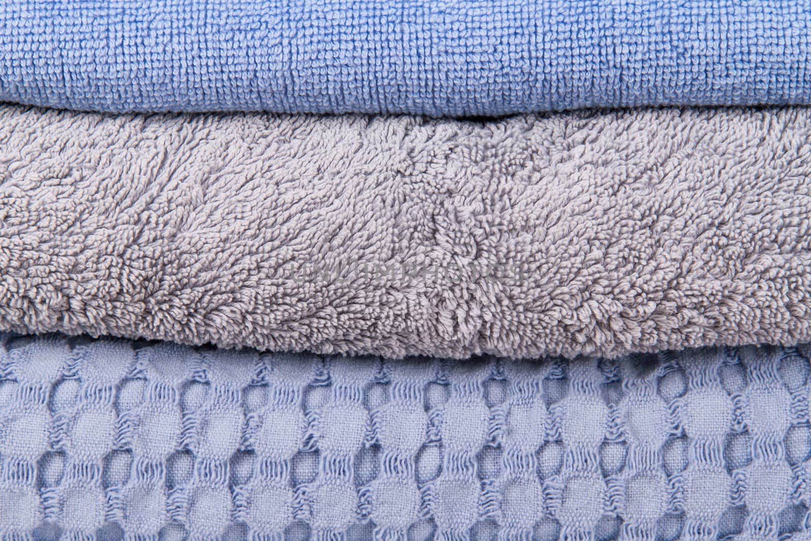 Blue stacked bathroom towels.