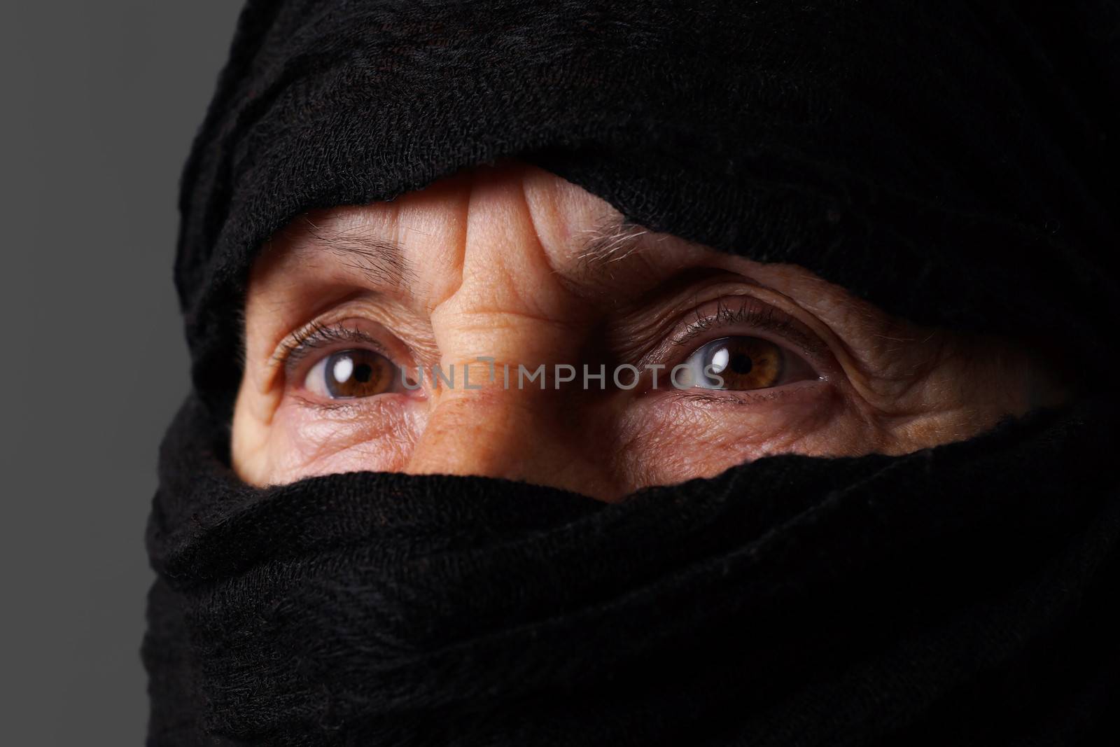 Eyes of senior muslim woman with niqab 