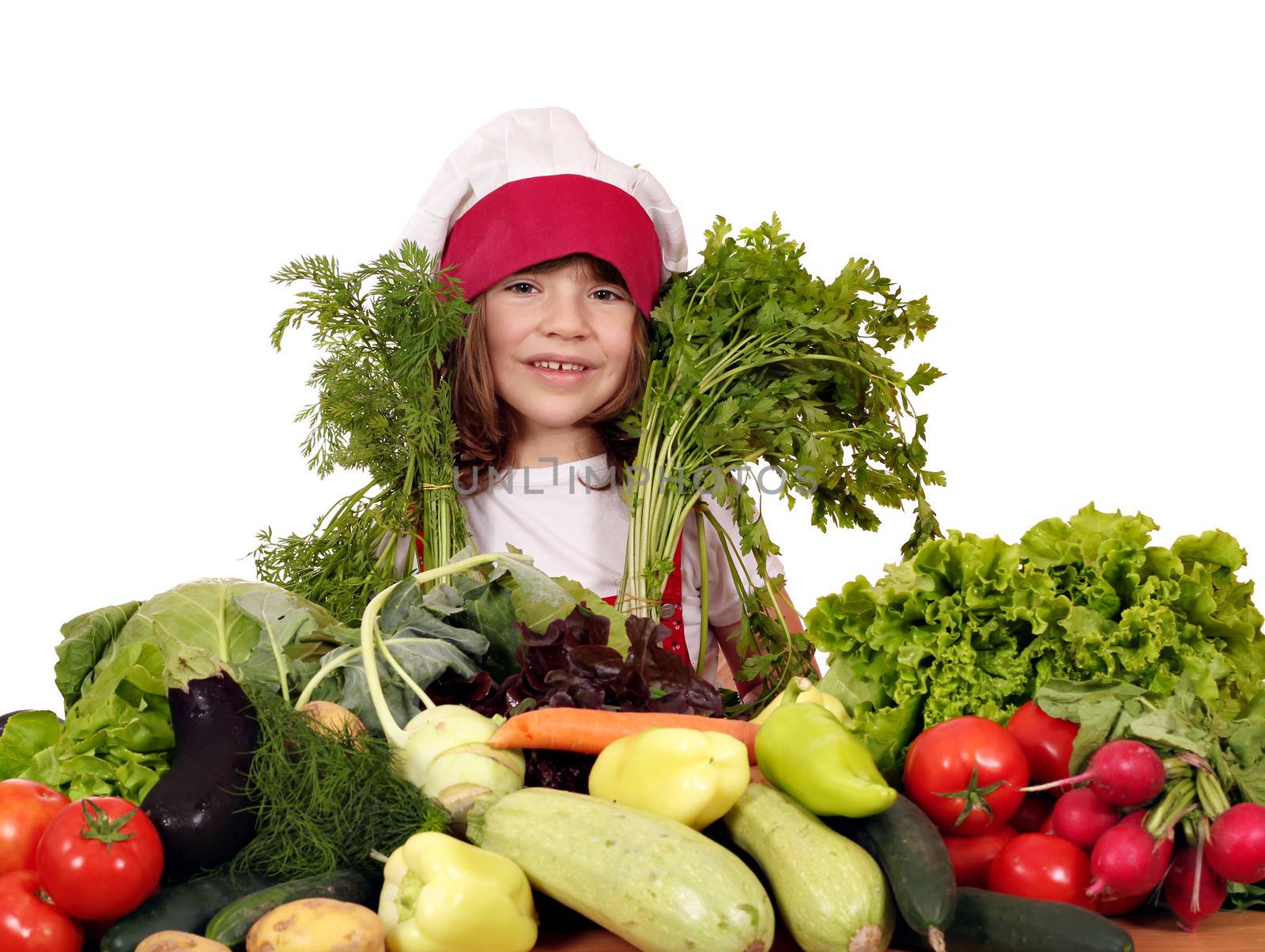 beautiful little girl cook with different vegetables