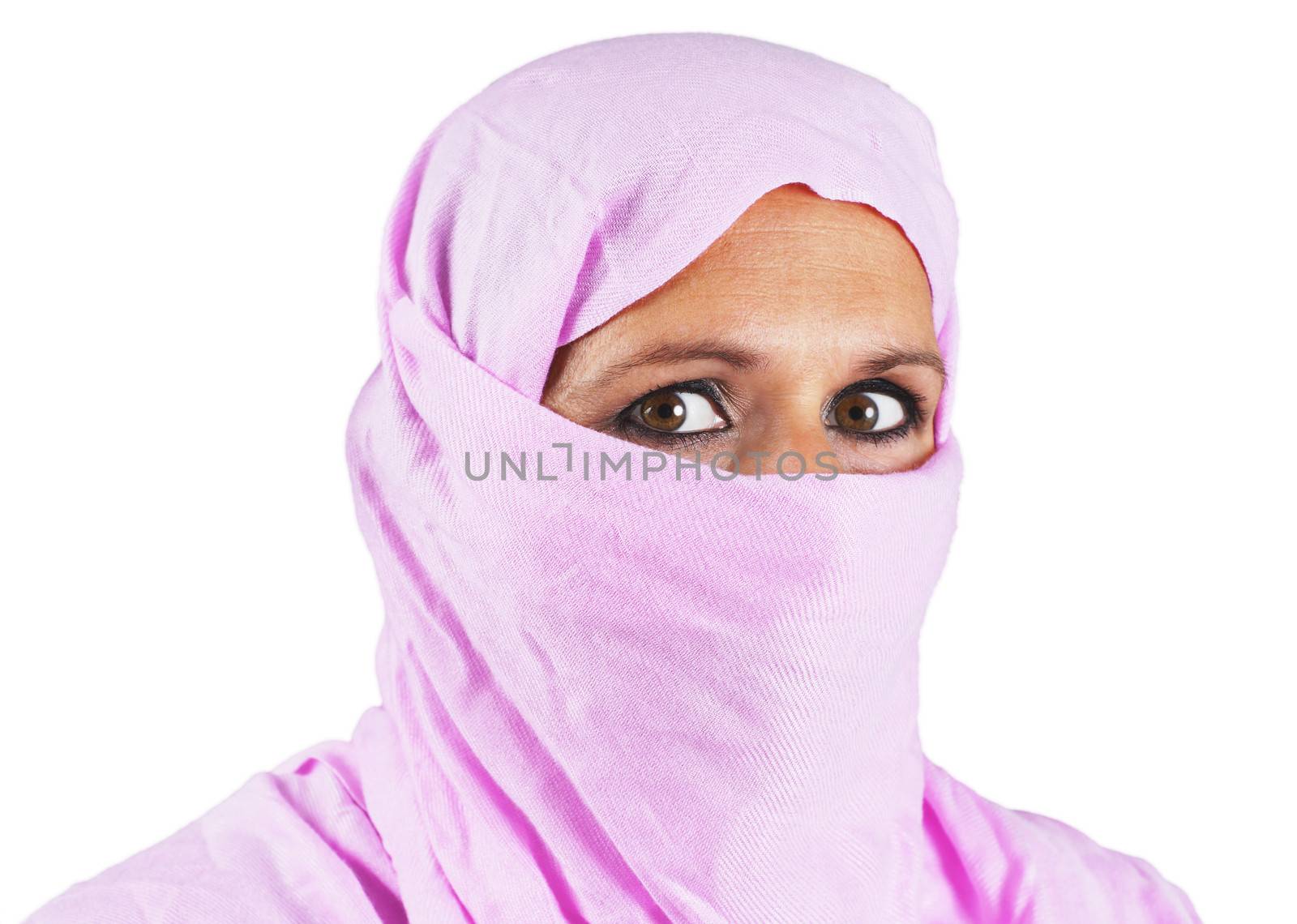 Portrait of serious middle aged muslim woman with pink scarf or hijab