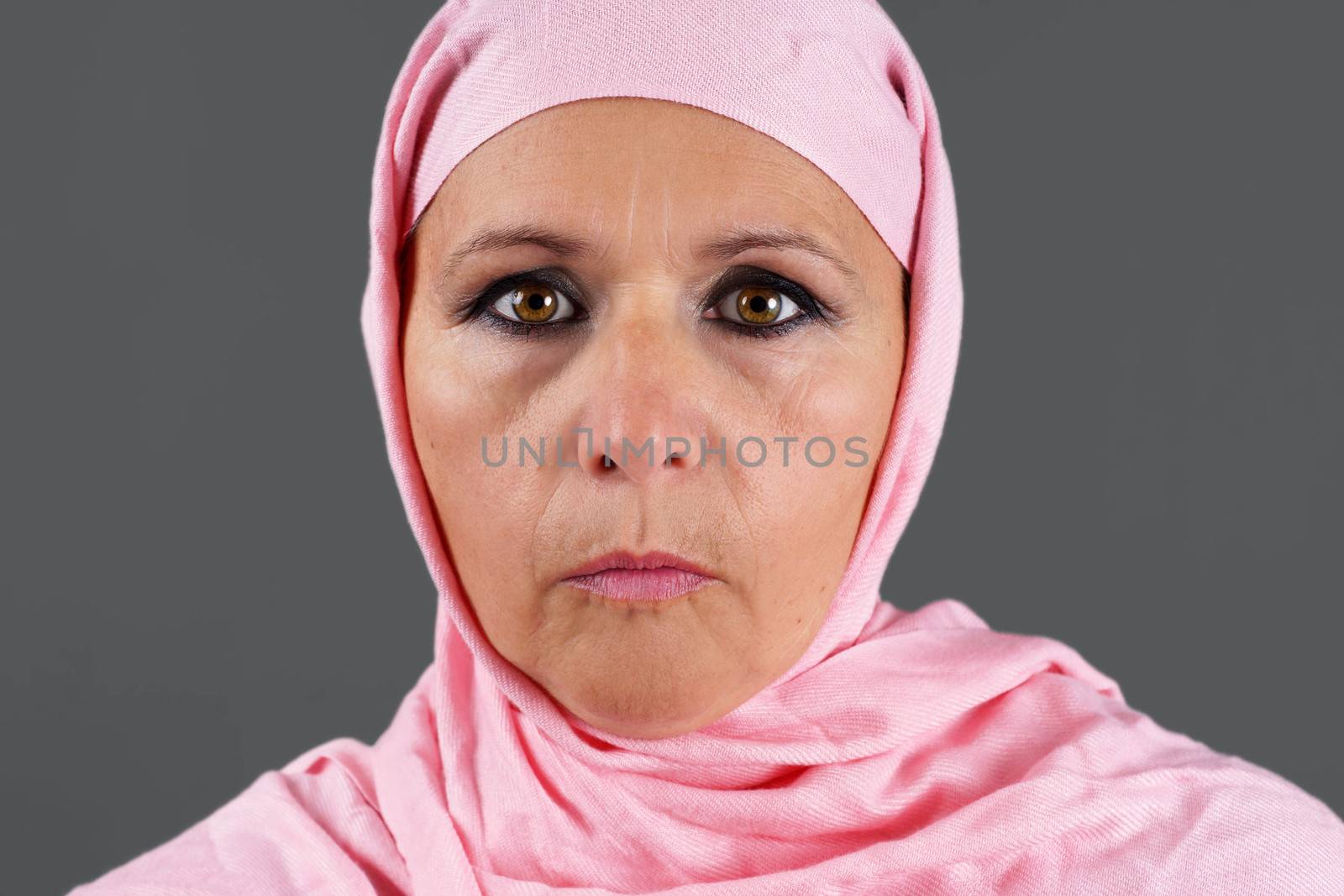 Middle aged muslim in pink scarf by Mirage3
