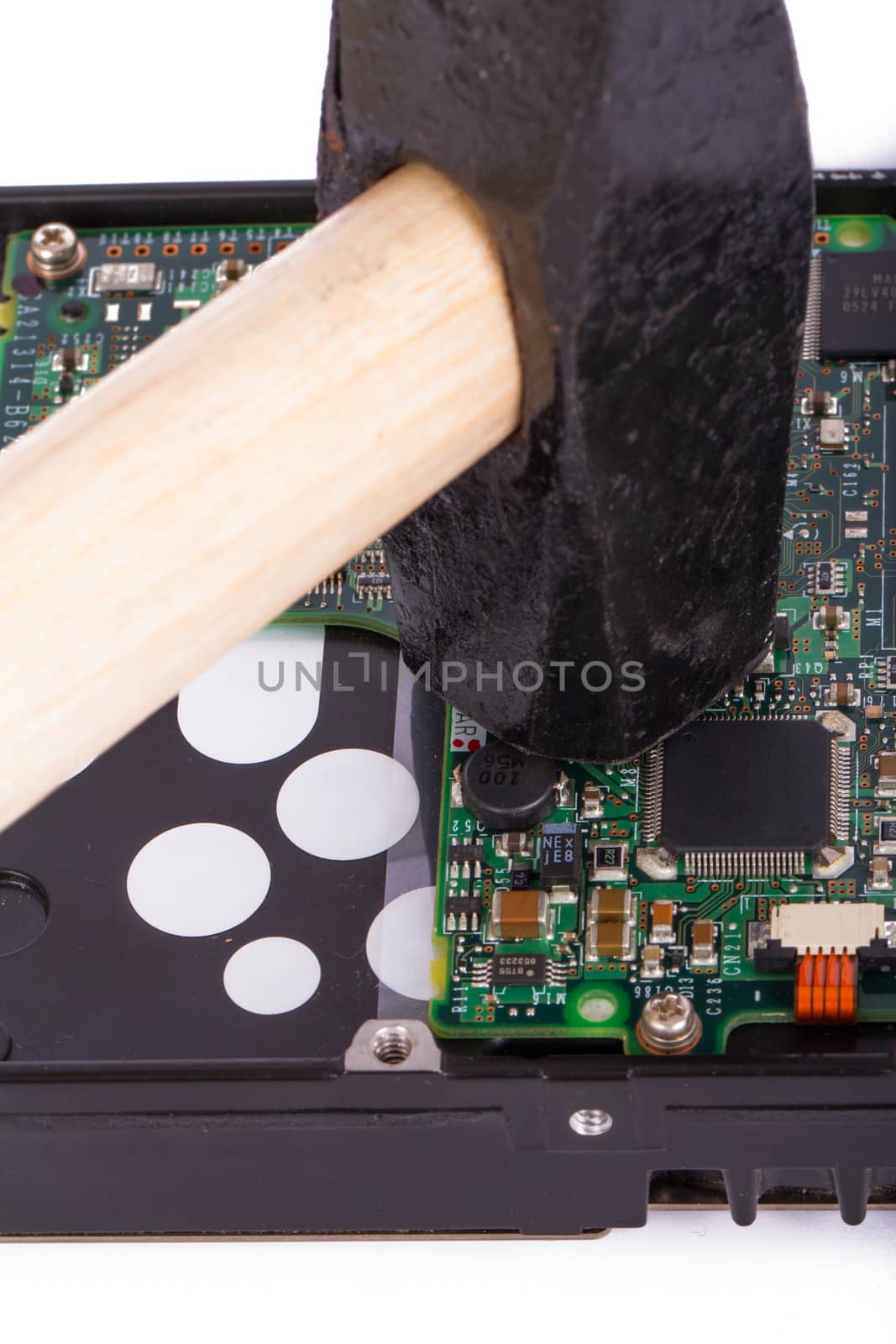 Hammer hitting hard disk, isolated on white background.
