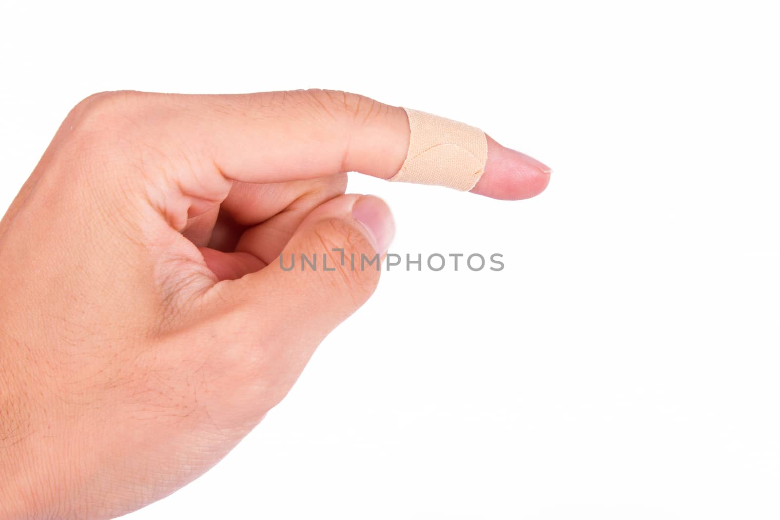 Adhesive bandage, plaster on index finger, isolated on white background.