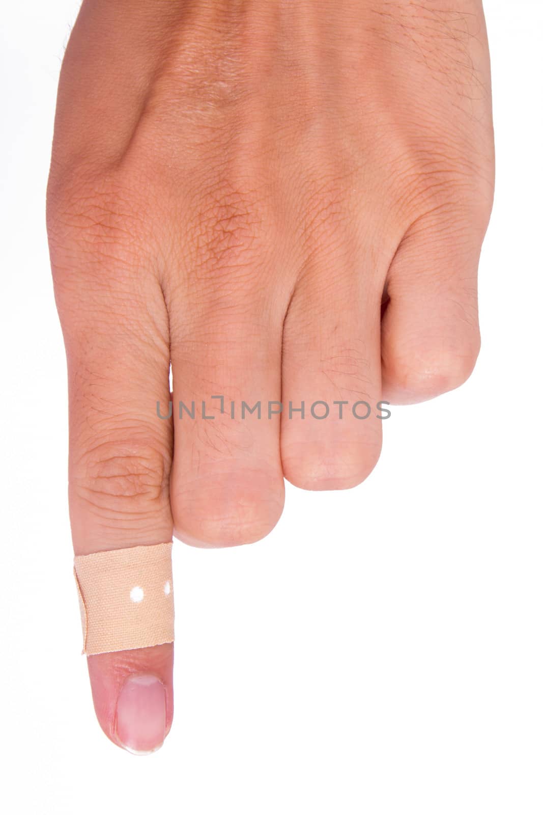 Adhesive bandage, plaster on index finger, isolated on white background.