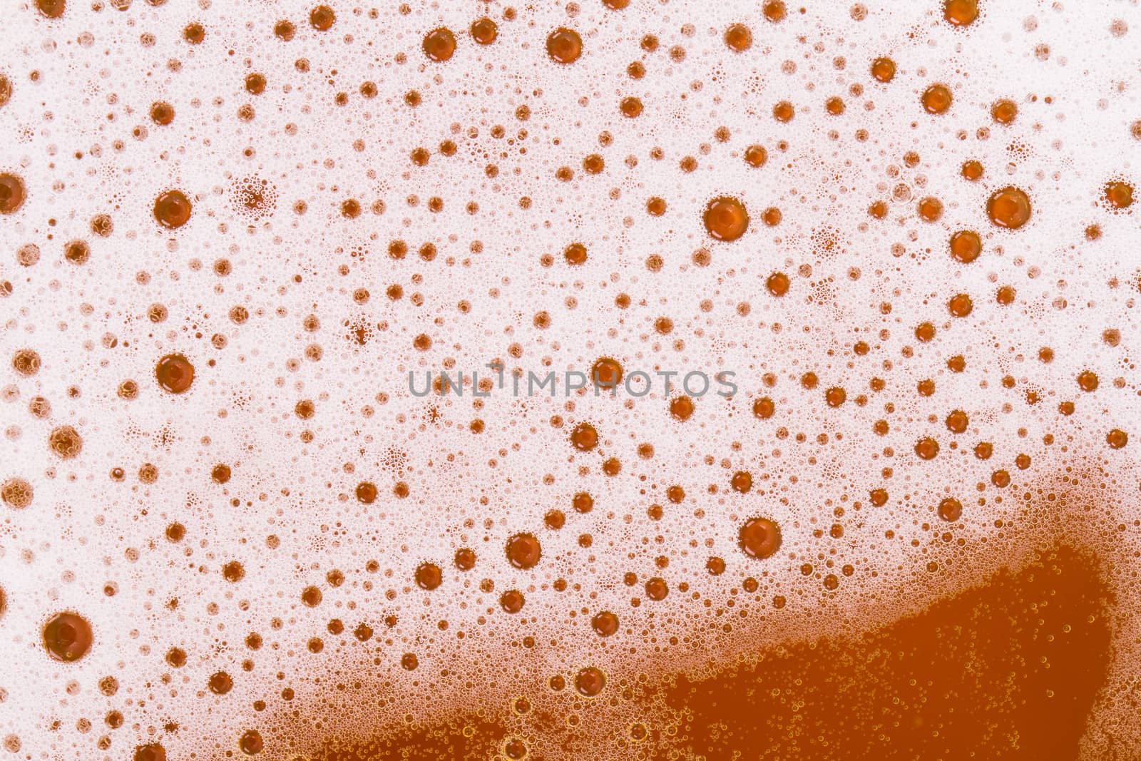 Macro view of beer foam, top view.