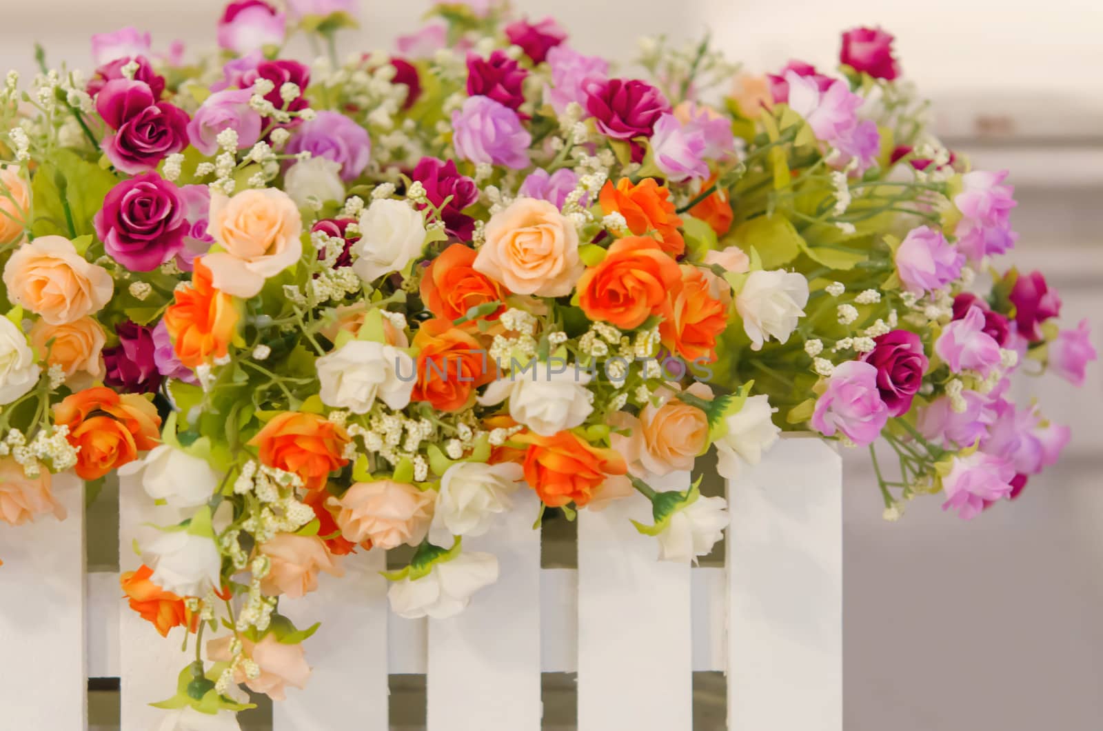 Bouquet of plastic roses and mix colorful of flowers