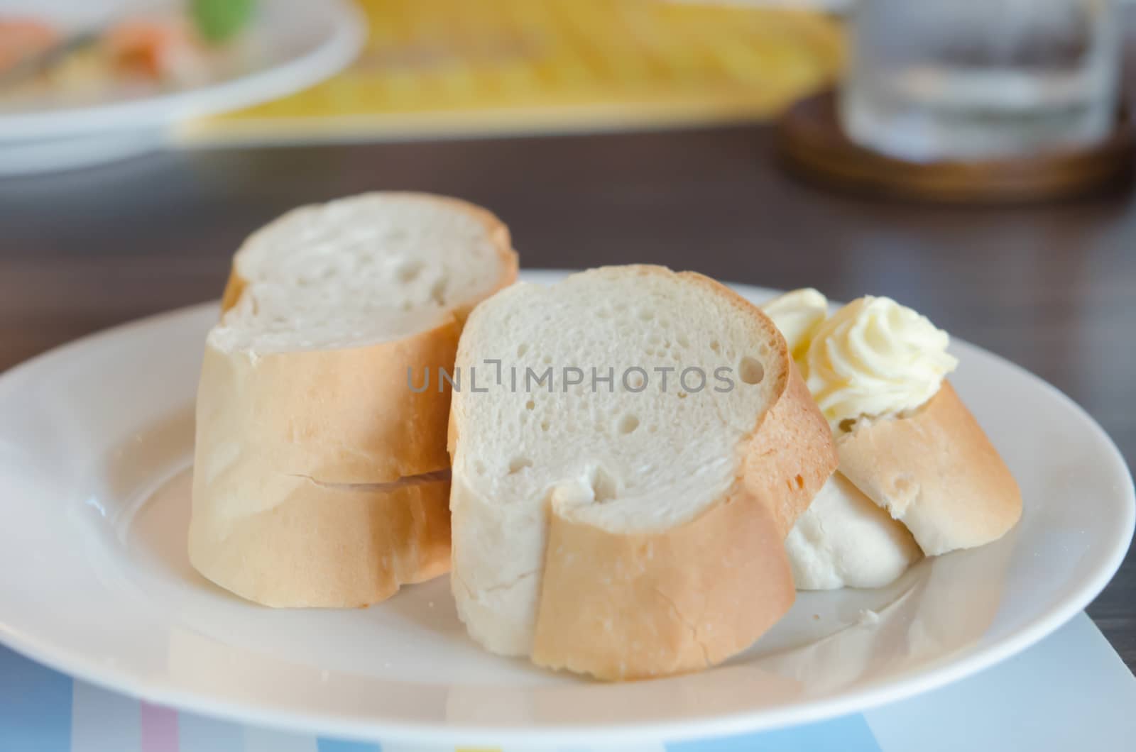 close up  slice of bread on white dish with delicious cheese