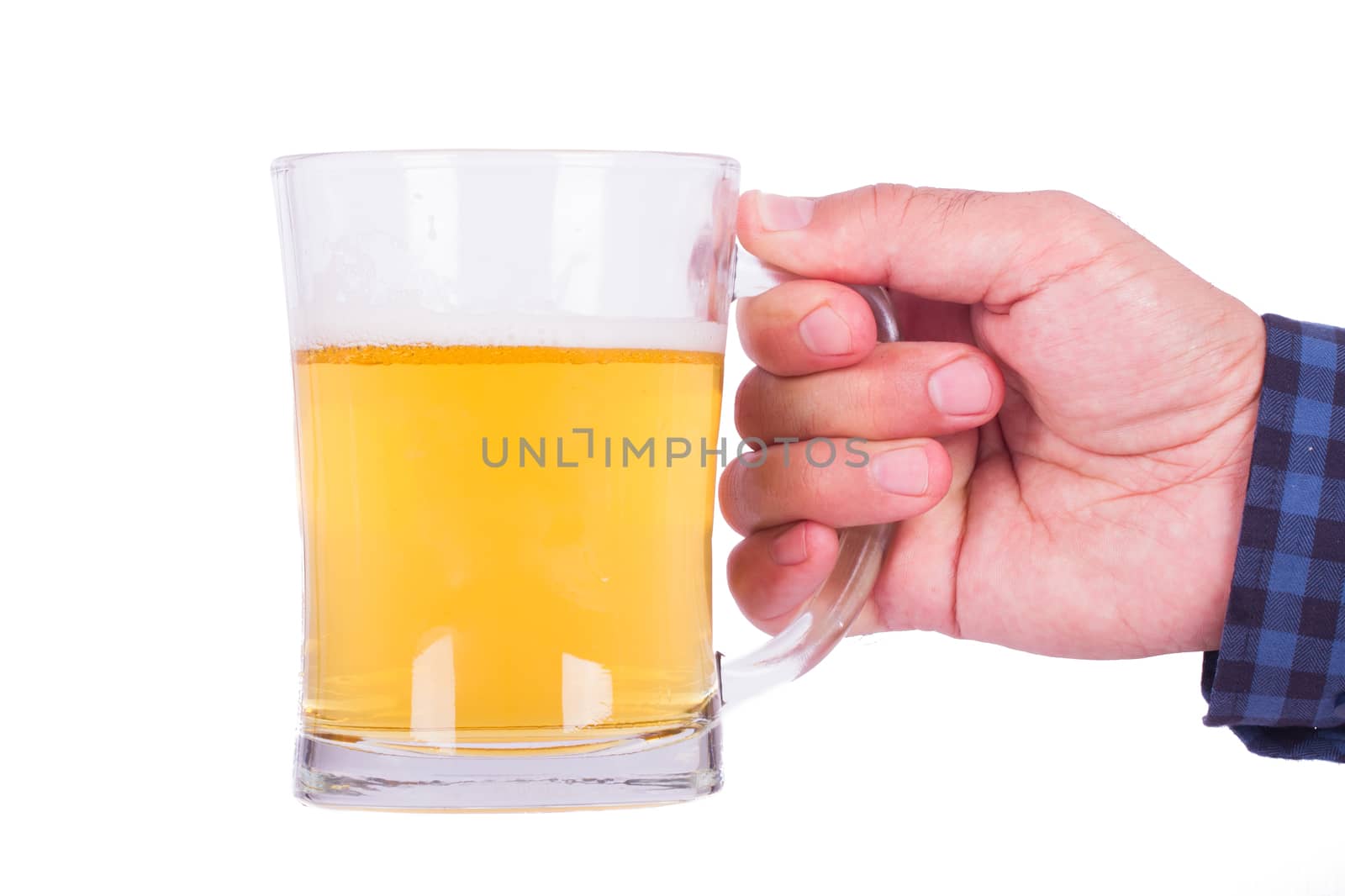 Hand holding full beer glass, isolated on white background.